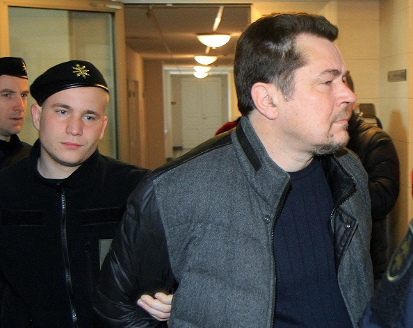 Photo of Evaldas Rimasauskas being arrested
